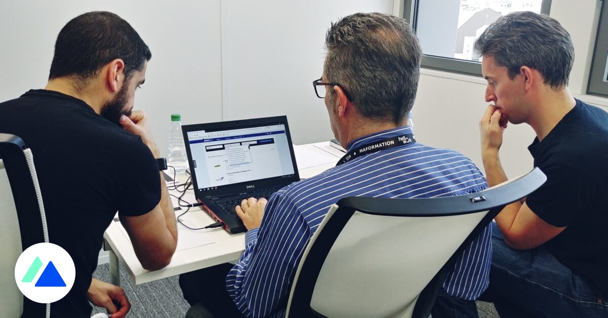 Product team observing a live usability testing session around a prototype