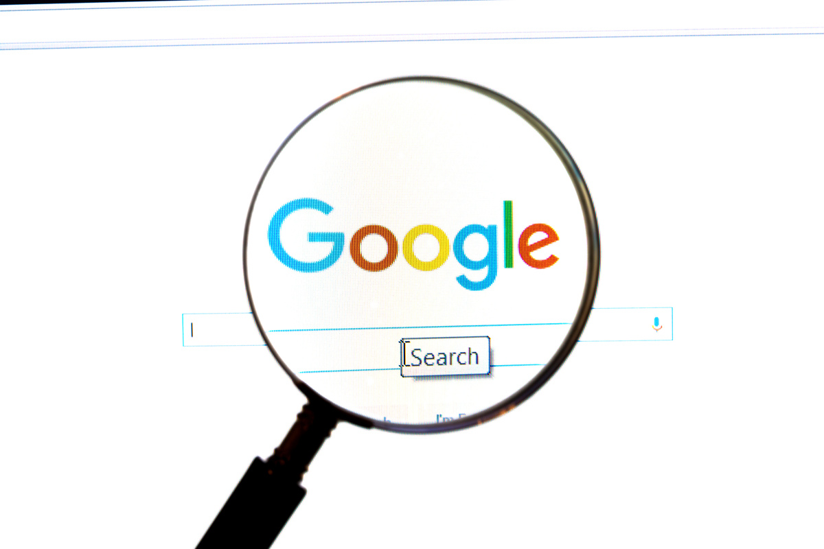 Ostersund, Sweden -December 1, 2015: Google website under a magnifying glass. Google is the world’s most popular search engine
