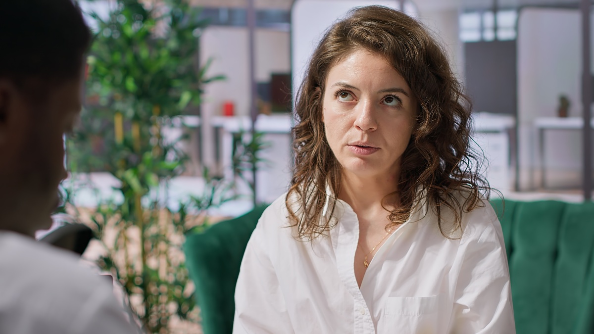 Staff interviewing woman applicant job seeker in high end office