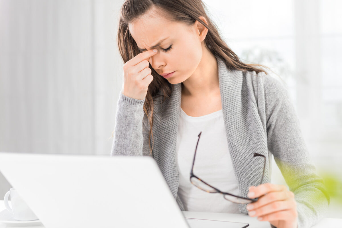 Young woman is tired and feels stressed out.